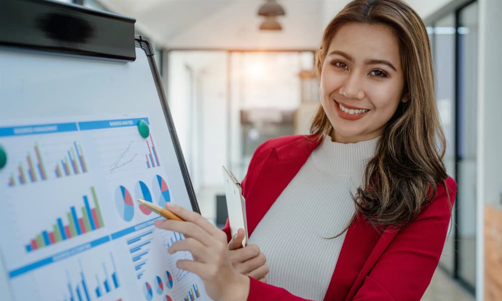 Young business woman presenting marketing profit with confidence within investment and seminar for finance planning.